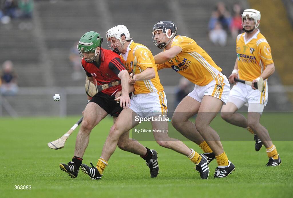 28 June 2009; Ruari McGrattan, Down, in action against Shane McNaughton and Cormac Donnelly, Anrtrim. GAA Hurling Ulster Senior Championship Final, Antrim v Down, Casement Park, Belfast, Co. Antrim. Picture credit: Oliver McVeigh / SPORTSFILE *** Local Caption ***