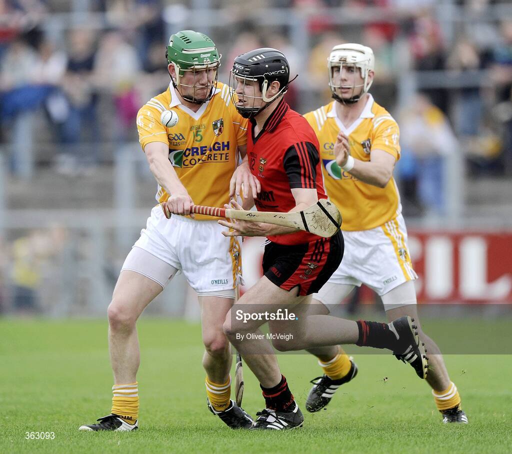 28 June 2009; Kieran Courtney, Down, in action against Joey Scullion and Shane McNaughton, Anrtrim. GAA Hurling Ulster Senior Championship Final, Antrim v Down, Casement Park, Belfast, Co. Antrim. Picture credit: Oliver McVeigh / SPORTSFILE *** Local Caption ***