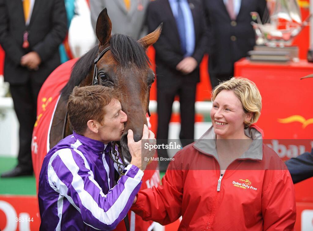 28 June 2009; Johnny Murtagh celebrates with Fame And Glory after winning the Dubai Duty Free Irish Derby as groom Routh Stapleton looks on. Irish Derby Festival - Sunday, Curragh Racecourse, Co. Kildare. Picture credit: Matt Browne / SPORTSFILE