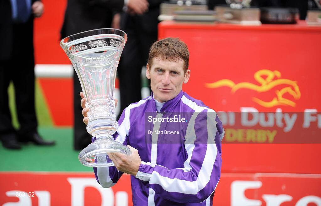 28 June 2009; Johnny Murtagh celebrates with the trophy after winning the Dubai Duty Free Irish Derby on Fame And Glory. Irish Derby Festival - Sunday, Curragh Racecourse, Co. Kildare. Picture credit: Matt Browne / SPORTSFILE