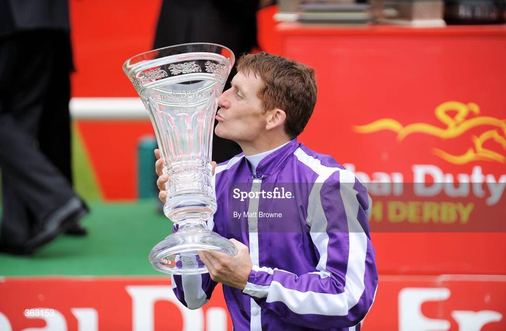 28 June 2009; Johnny Murtagh celebrates with the trophy after winning the Dubai Duty Free Irish Derby on Fame And Glory. Irish Derby Festival - Sunday, Curragh Racecourse, Co. Kildare. Picture credit: Matt Browne / SPORTSFILE