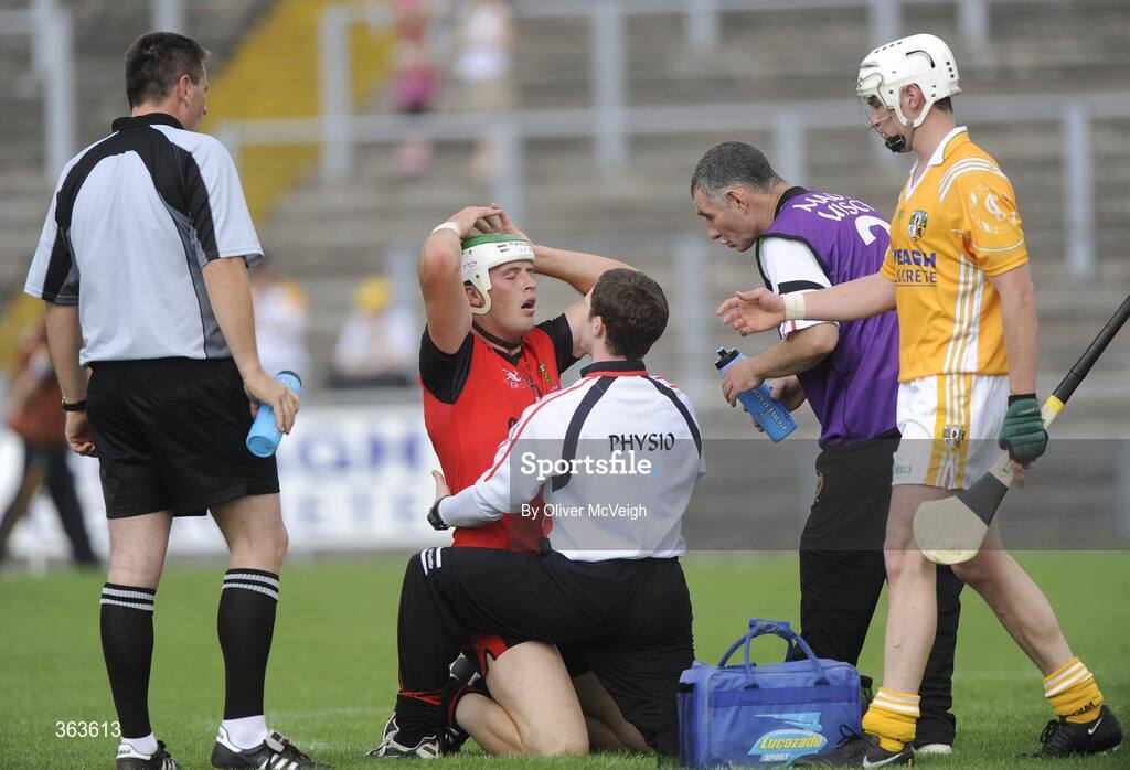 28 June 2009; Gareth Johnston, Down, receives treatment from the team physio. GAA Hurling Ulster Senior Championship Final, Antrim v Down, Casement Park, Belfast, Co. Antrim. Picture credit: Oliver McVeigh / SPORTSFILE