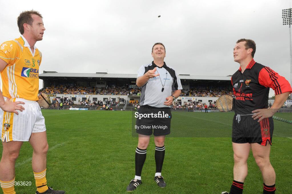 28 June 2009; Referee Brian Gavin tosses the coin as Antrim captain Neil McGarry, left, and Down captain Graham Clarke look on. GAA Hurling Ulster Senior Championship Final, Antrim v Down, Casement Park, Belfast, Co. Antrim. Picture credit: Oliver McVeigh / SPORTSFILE