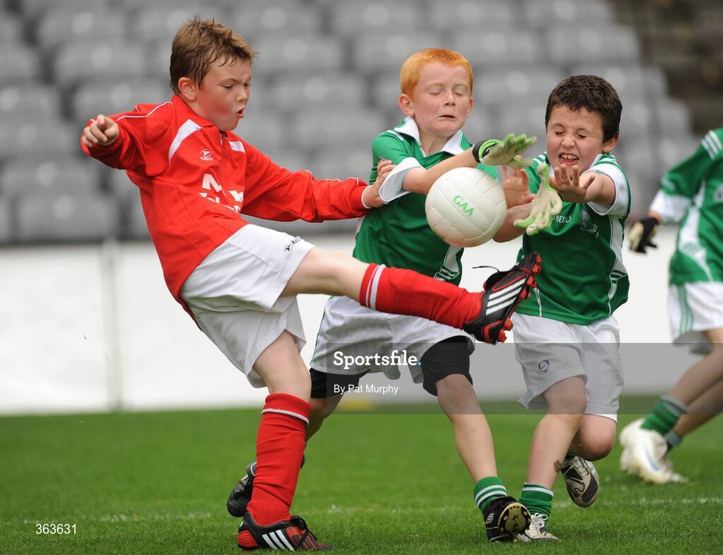 1 July 2009; Rory Hanlon, St. Nicholas, Co. Louth, has his shot blocked by Ross Bolger and Eoin Fitzpatrick, right, Killeshan, Co. Laois, during the Leinster GAA Go Games ‘Play & Stay with the GAA’ activity day. Croke Park, Dublin. Picture credit: Pat Murphy / SPORTSFILE