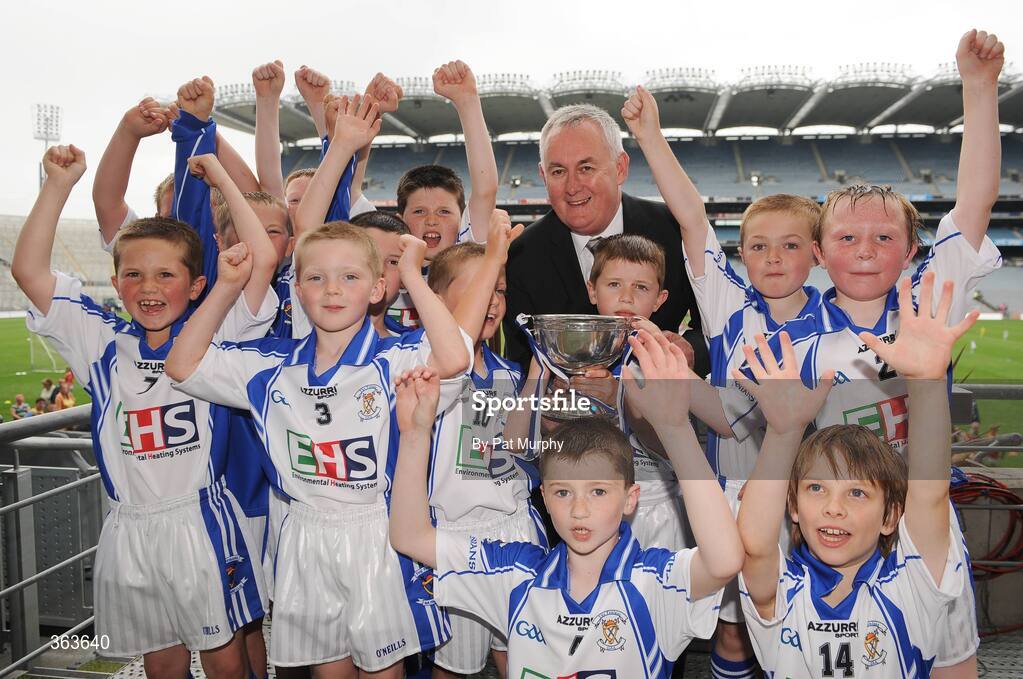 1 July 2009; The Fenians team, from Johnstown, Co. Kilkenny, celebrate with Uachtarán Chumann Lúthchleas Gael Criostóir Ó Cuana after lifting the cup following their game against Askemore, Co. Wexford, during the Leinster GAA Go Games ‘Play & Stay with the GAA’ activity day. Croke Park, Dublin. Picture credit: Pat Murphy / SPORTSFILE