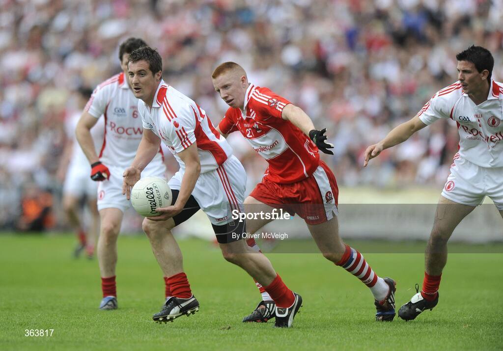 21 June 2009; Brian McGuigan, Tyrone, in action against Seamus Bradley, Derry. GAA Football Ulster Senior Championship Semi-Final, Tyrone v Derry, Casement Park, Belfast, Co. Antrim. Picture credit: Oliver McVeigh / SPORTSFILE
