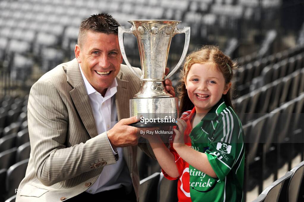 1 July 2009; Five-year-old Chloe Danton with TV3 football panellist Senan Connell and the Munster Championship Cup at the TV3 Silverware Sunday photocall. Croke Park, Dublin. Picture credit: Ray McManus / SPORTSFILE