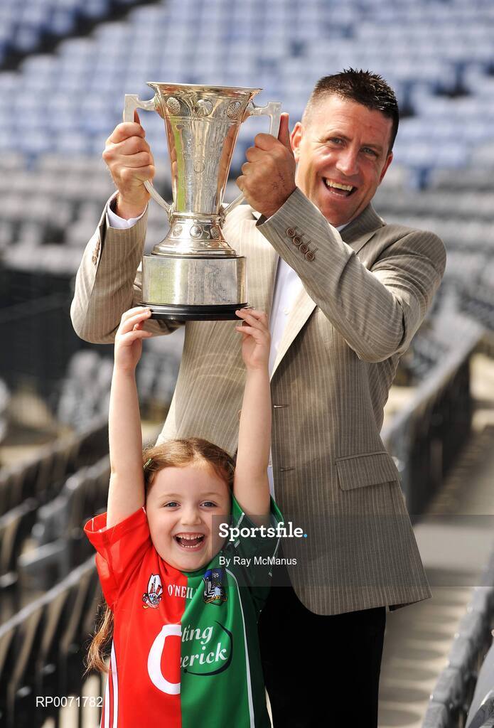 1 July 2009; Five-year-old Chloe Danton with TV3 football panellist Senan Connell and the Munster Championship Cup at the TV3 Silverware Sunday photocall. Croke Park, Dublin. Picture credit: Ray McManus / SPORTSFILE