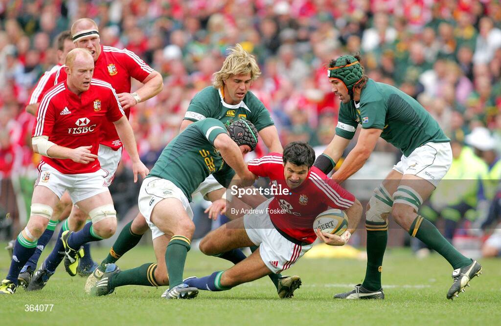 4 July 2009; Mike Phillips, British and Irish Lions,is tackled by Heinrich Brussow, Wynland Olivier and Martyn Williams, South Africa. 3rd Test, South Africa v British and Irish Lions, Ellis Park, Johannesburg, South Africa. Picture credit: Andrew Fosker / SPORTSFILE