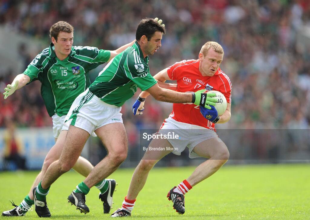 5 July 2009; Ger Spillane, Cork, in action against John Galvin and Ian Ryan, 15, Limerick. GAA Football Munster Senior Championship Final, Limerick v Cork, Pairc Ui Chaoimh, Cork. Picture credit: Brendan Moran / SPORTSFILE