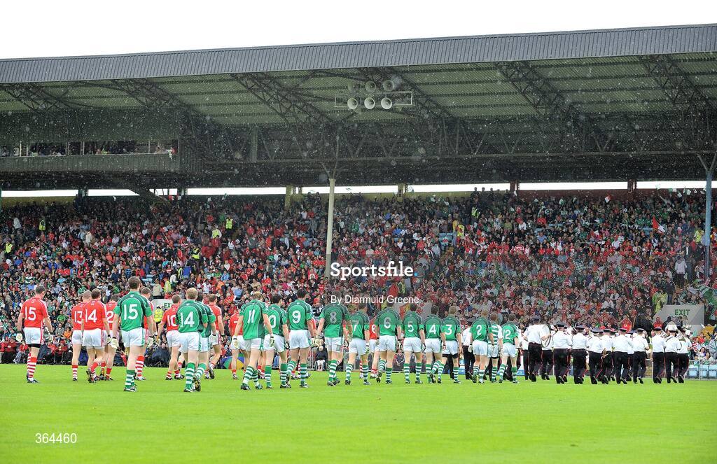 5 July 2009; The Limerick and Cork teams march in the pre-match parade in front of the main stand before the game. GAA Football Munster Senior Championship Final, Limerick v Cork, Pairc Ui Chaoimh, Cork. Picture credit: Diarmuid Greene / SPORTSFILE