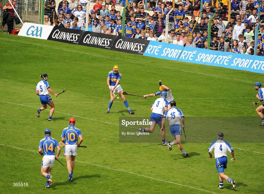 12 July 2009; Tipperary's Seamus Callanan, no.11, shoots to score his side's first goal. GAA Hurling Munster Senior Championship Final, Tipperary v Waterford, Semple Stadium, Thurles, Co. Tipperary. Picture credit: Brian Lawless / SPORTSFILE