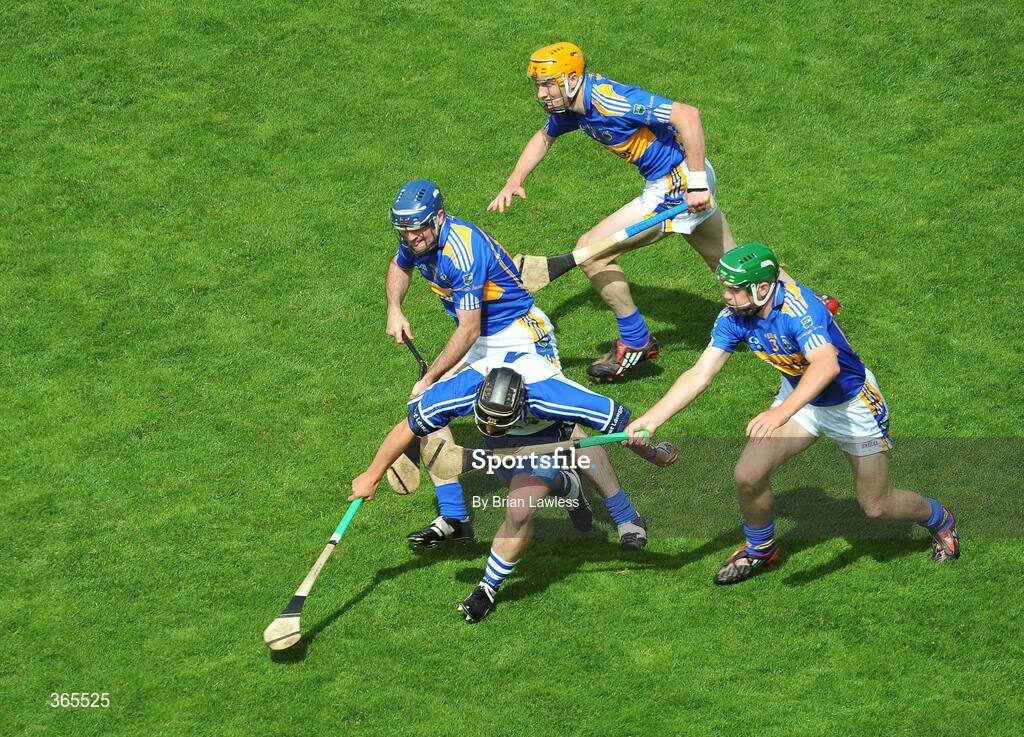 12 July 2009; Waterford's Noel Connors is surrounded by Tipperary players, from left, Eoin Kelly, Lar Corbett, and Noel McGrath. GAA Hurling Munster Senior Championship Final, Tipperary v Waterford, Semple Stadium, Thurles, Co. Tipperary. Picture credit: Brian Lawless / SPORTSFILE
