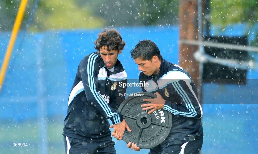 18 July 2009; Real Madrid's Cristiano Ronaldo, right, and team-mate Raul lift a weight during heavy rain at squad training. Real Madrid pre-season squad training, Carton House, Maynooth, Co. Kildare. Picture credit: David Maher / SPORTSFILE