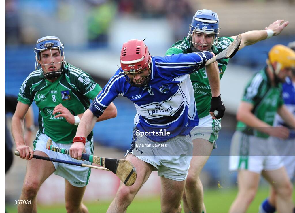 18 July 2009; Owen Holohan, Laois, in action against Gavin O'Mahoney, left, and Stephen Lucey, Limerick. GAA All-Ireland Senior Hurling Championship, Phase 3, Laois v Limerick, Semple Stadium, Thurles, Co. Tipperary. Picture credit: Brian Lawless / SPORTSFILE