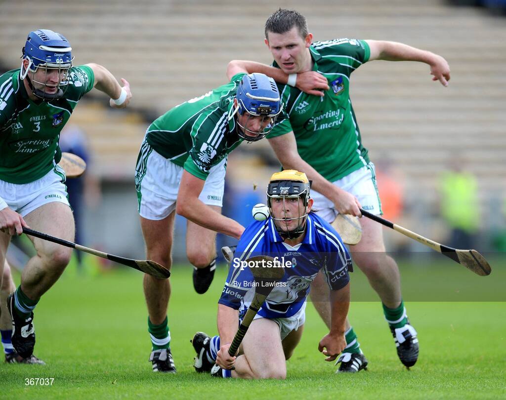 18 July 2009; Colin Delaney, Laois, in action against, from left, Stephen Lucey, Gavin O'Mahoney, and Mark Foley, Limerick. GAA All-Ireland Senior Hurling Championship, Phase 3, Laois v Limerick, Semple Stadium, Thurles, Co. Tipperary. Picture credit: Brian Lawless / SPORTSFILE