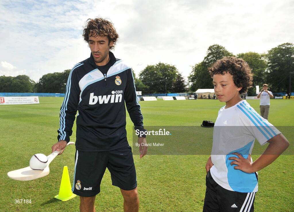 19 July 2009; Real Madrid's Raul shows his hurling skills to Harry Matthews, from Dublin, during a special training session run by adidas and Lifestyle Sports. Real Madrid pre-season squad training, Carton House, Maynooth, Co. Kildare. Picture credit: David Maher / SPORTSFILE