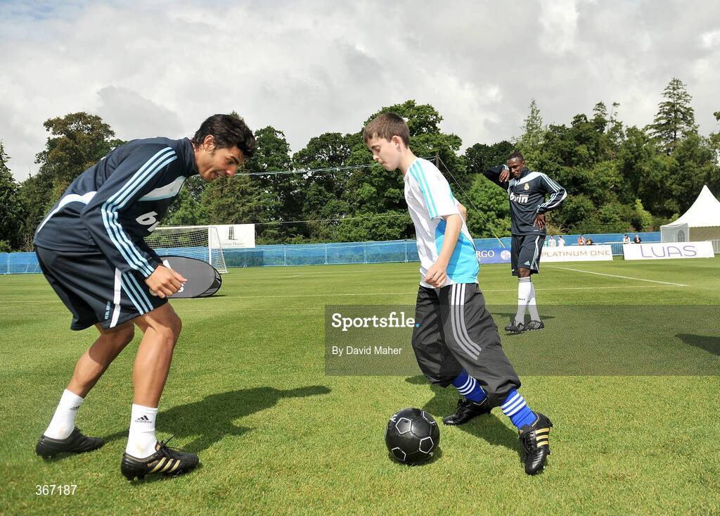 19 July 2009; James Grace, from Newbridge, Co. Kildare, shows his skills to Real Madrid's Torres during a special training session run by adidas and Lifestyle Sports. Real Madrid pre-season squad training, Carton House, Maynooth, Co. Kildare. Picture credit: David Maher / SPORTSFILE