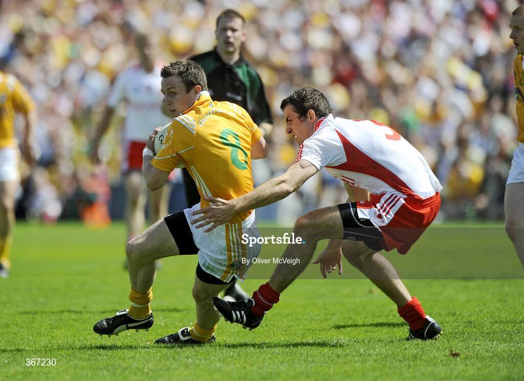 19 July 2009; Michael McCann, Antrim, in action against Justin McMahon, Tyrone. GAA Football Ulster Senior Championship Final, Tyrone v Antrim, St Tighearnach's Park, Clones, Co. Monaghan. Picture credit: Oliver McVeigh / SPORTSFILE