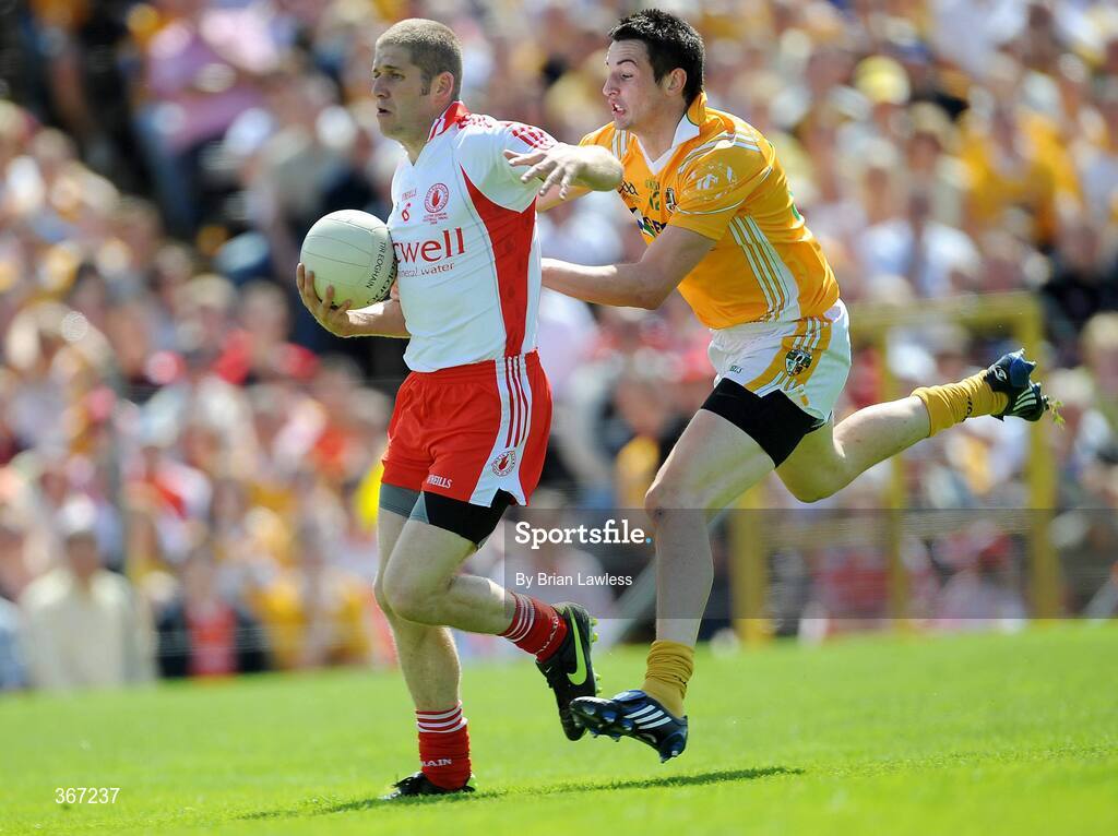 19 July 2009; Kevin Hughes, Tyrone, in action against Niall McKeever, Antrim. GAA Football Ulster Senior Championship Final, Tyrone v Antrim, St Tighearnach's Park, Clones, Co. Monaghan. Picture credit: Brian Lawless / SPORTSFILE