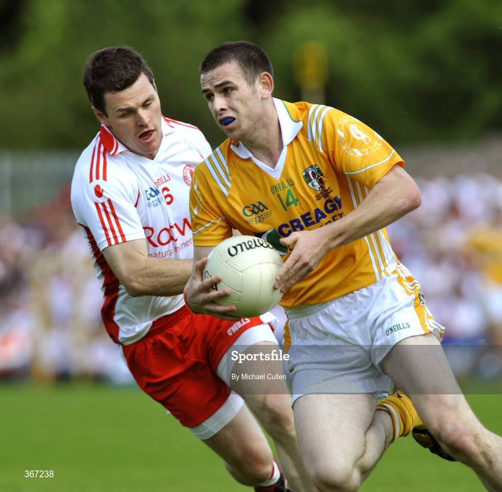 19 July 2009; Conor Gormley, Tyrone, in action against Sean Burke, Antrim. GAA Football Ulster Senior Championship Final, Tyrone v Antrim, St Tighearnach's Park, Clones, Co. Monaghan. Picture credit: Michael Cullen / SPORTSFILE