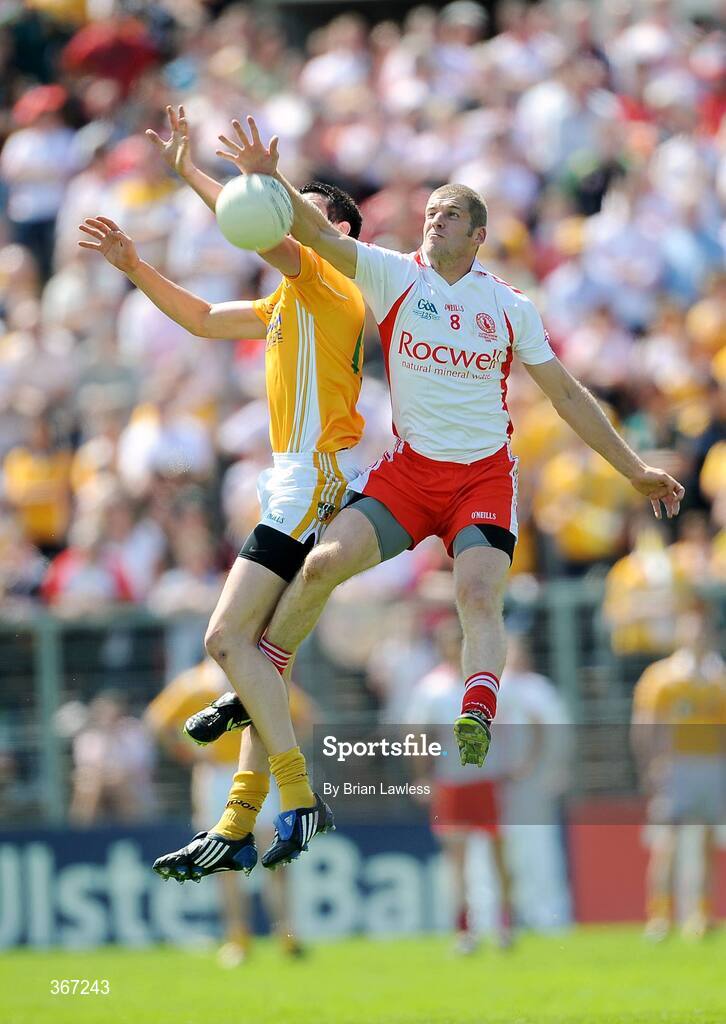 19 July 2009; Kevin Hughes, Tyrone, in action against Niall McKeever, Antrim. GAA Football Ulster Senior Championship Final, Tyrone v Antrim, St Tighearnach's Park, Clones, Co. Monaghan. Picture credit: Brian Lawless / SPORTSFILE