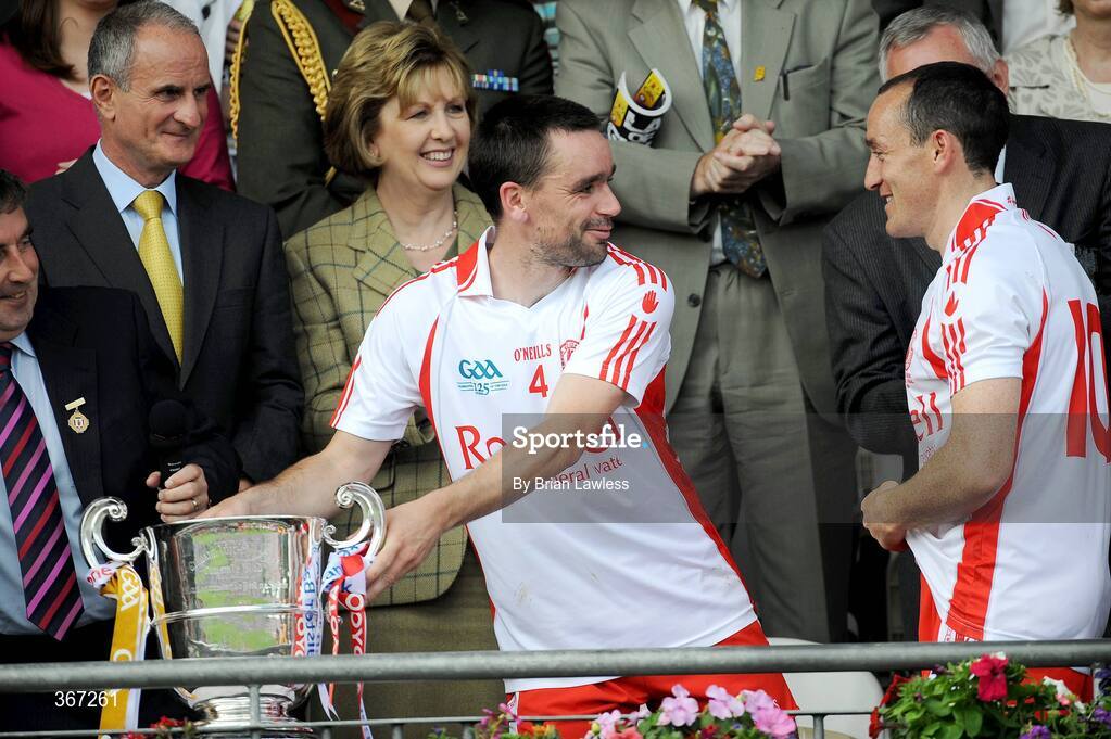 19 July 2009; Tyrone's Ryan McMenamin shares a joke with team-mate and captain Brian Dooher as President of Ireland Mary McAleese and her husband Dr. Martin McAleese look on. GAA Football Ulster Senior Championship Final, Tyrone v Antrim, St Tighearnach's Park, Clones, Co. Monaghan. Picture credit: Brian Lawless / SPORTSFILE