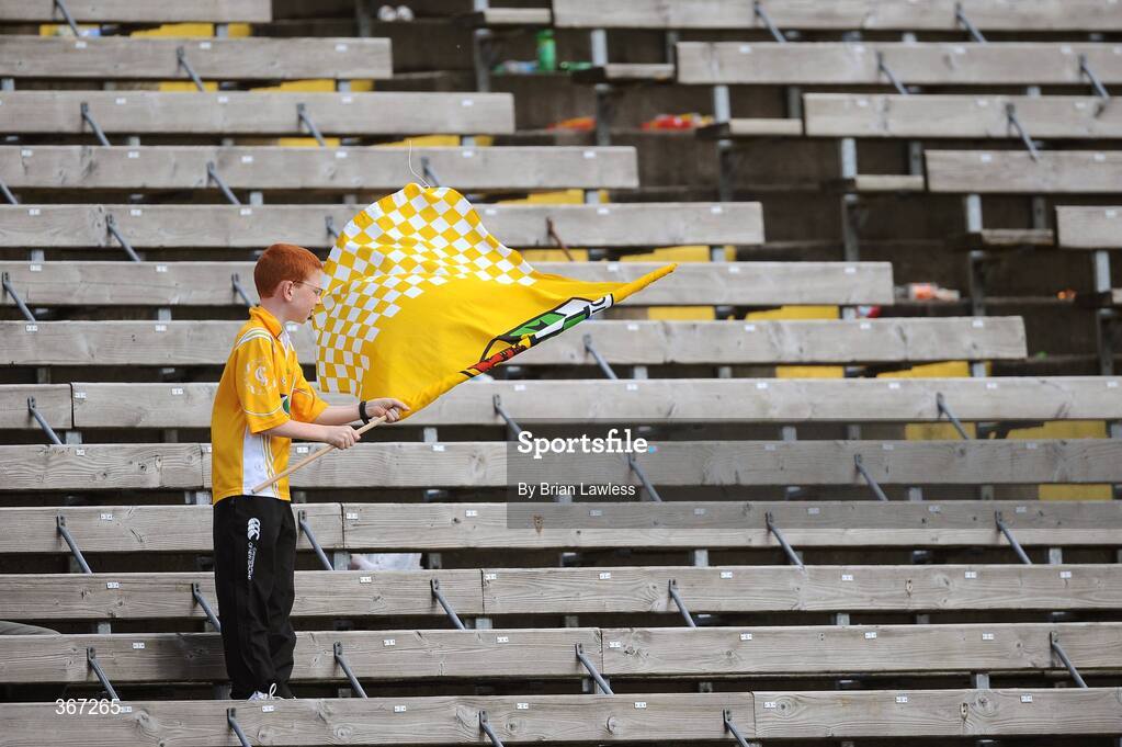 19 July 2009; A lone Antrim fan rolls up his flag after the match. GAA Football Ulster Senior Championship Final, Tyrone v Antrim, St Tighearnach's Park, Clones, Co. Monaghan. Picture credit: Brian Lawless / SPORTSFILE