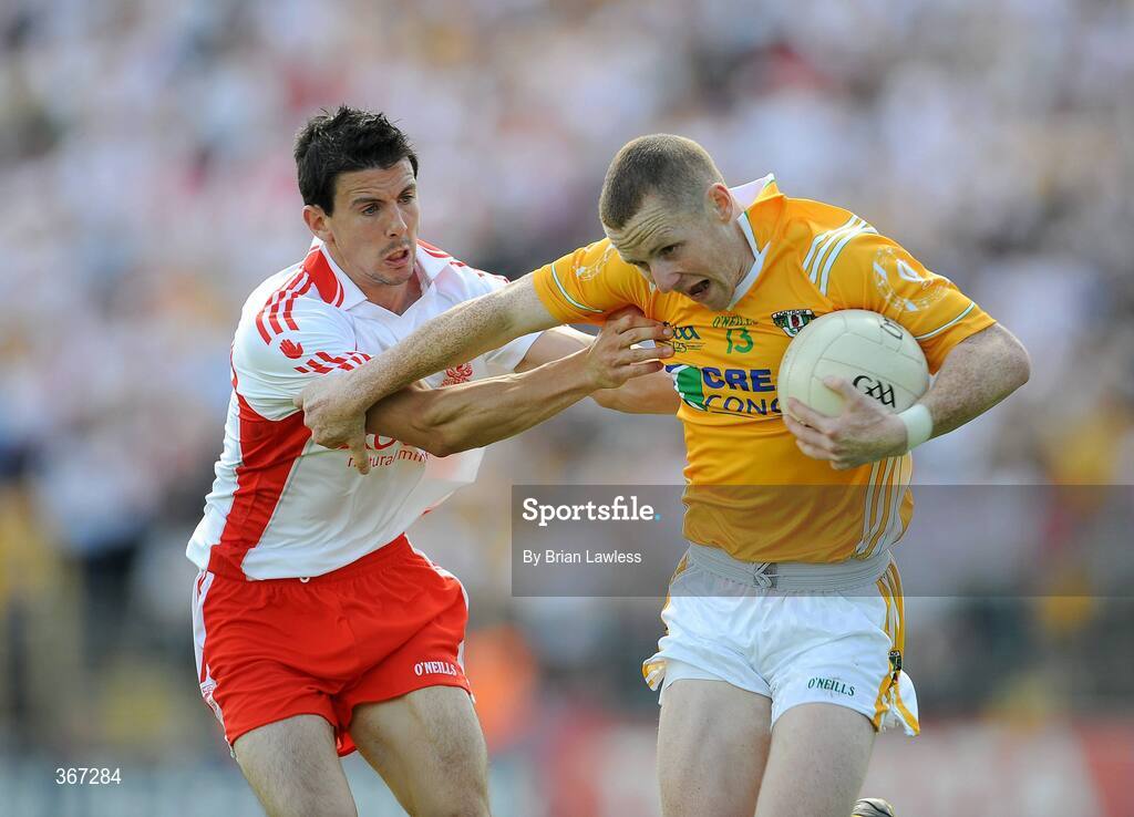 19 July 2009; Paddy Cunningham, Antrim, in action against PJ Quinn, Tyrone. GAA Football Ulster Senior Championship Final, Tyrone v Antrim, St Tighearnach's Park, Clones, Co. Monaghan. Picture credit: Brian Lawless / SPORTSFILE