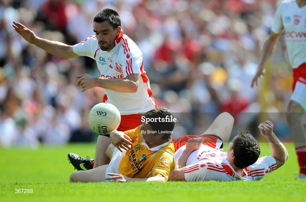 19 July 2009; Ryan McMenamin, left, and Enda McGinley, Tyrone, in action against Tomas McCann, Antrim. GAA Football Ulster Senior Championship Final, Tyrone v Antrim, St Tighearnach's Park, Clones, Co. Monaghan. Picture credit: Brian Lawless / SPORTSFILE
