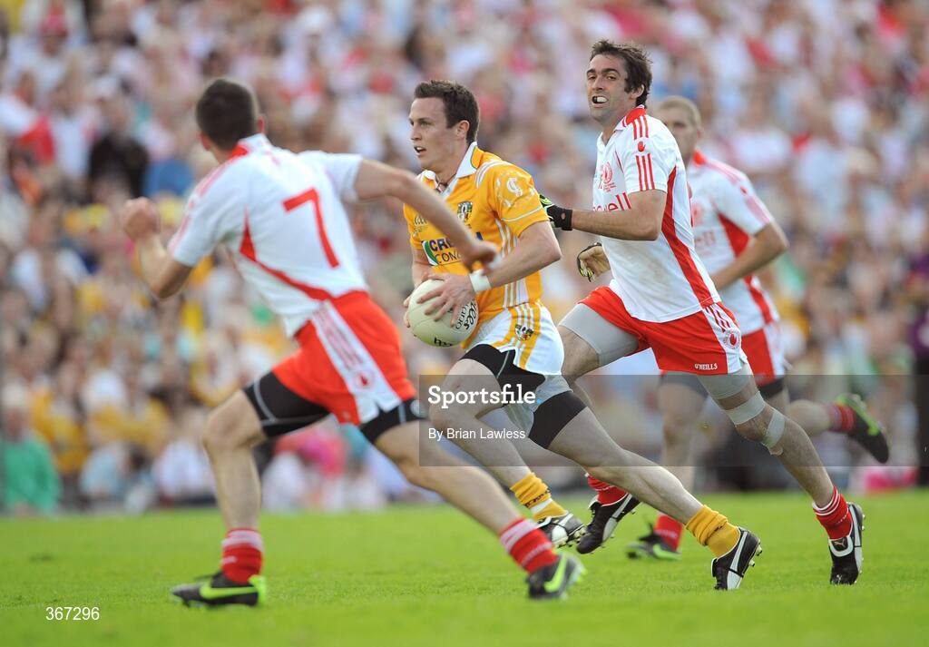 19 July 2009; Michael McCann, Antrim, in action against Philip Jordan, left, and Joe McMahon, Tyrone. GAA Football Ulster Senior Championship Final, Tyrone v Antrim, St Tighearnach's Park, Clones, Co. Monaghan. Picture credit: Brian Lawless / SPORTSFILE