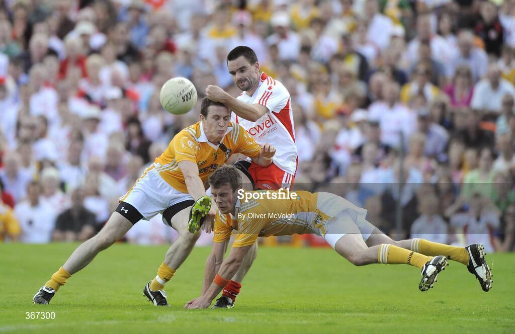 19 July 2009; Ryan McMenamin, Tyrone, in action against Michael McCann and James Loughrey, Antrim. GAA Football Ulster Senior Championship Final, Tyrone v Antrim, St Tighearnach's Park, Clones, Co. Monaghan. Picture credit: Oliver McVeigh / SPORTSFILE