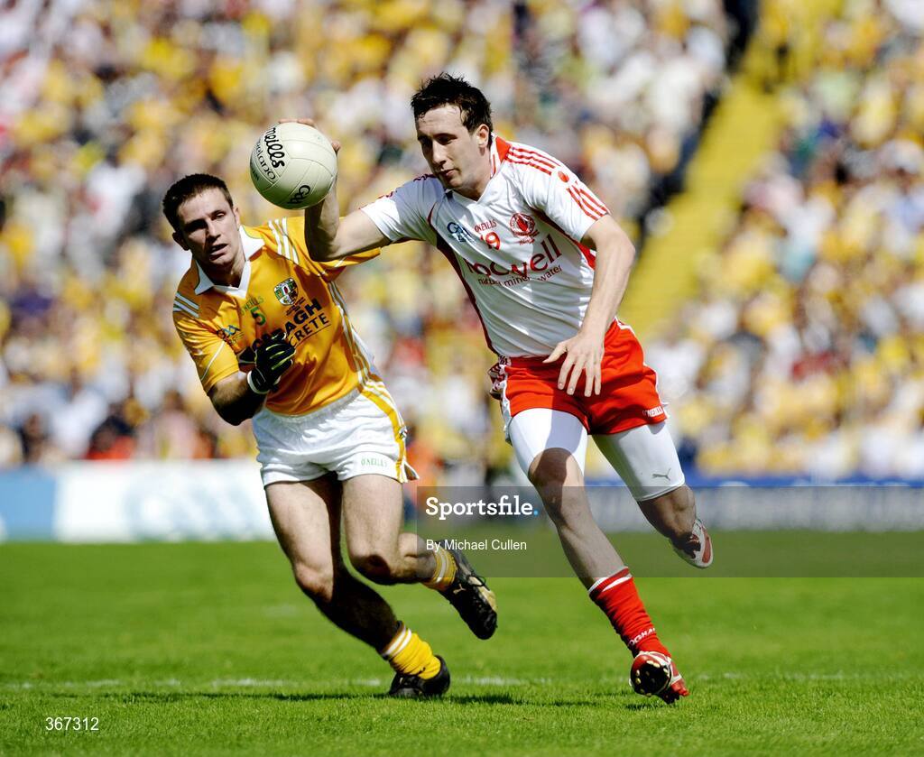 19 July 2009; Colm Cavanagh, Tyrone, in action against Tony Scullion, Antrim. GAA Football Ulster Senior Championship Final, Tyrone v Antrim, St Tighearnach's Park, Clones, Co. Monaghan. Picture credit: Michael Cullen / SPORTSFILE