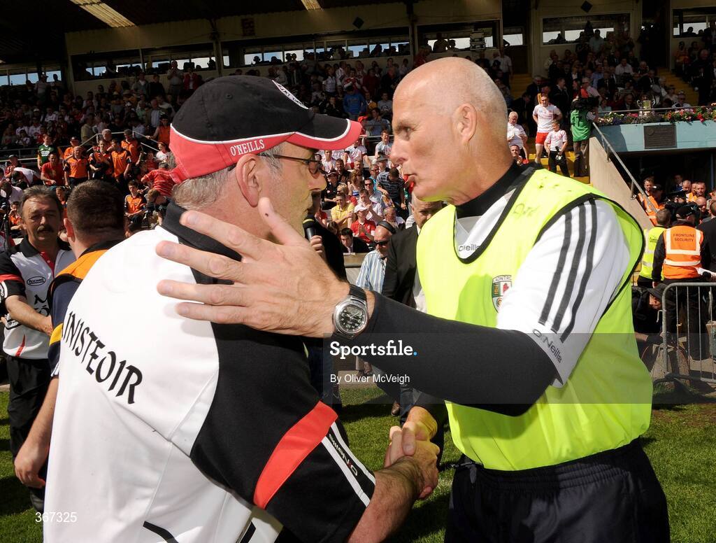 19 July 2009; Tyrone manager, Mickey Harte, left, commiserates with Antrim manager, Liam Bradley, after the final whistle. GAA Football Ulster Senior Championship Final, Tyrone v Antrim, St Tighearnach's Park, Clones, Co. Monaghan. Picture credit: Oliver McVeigh / SPORTSFILE