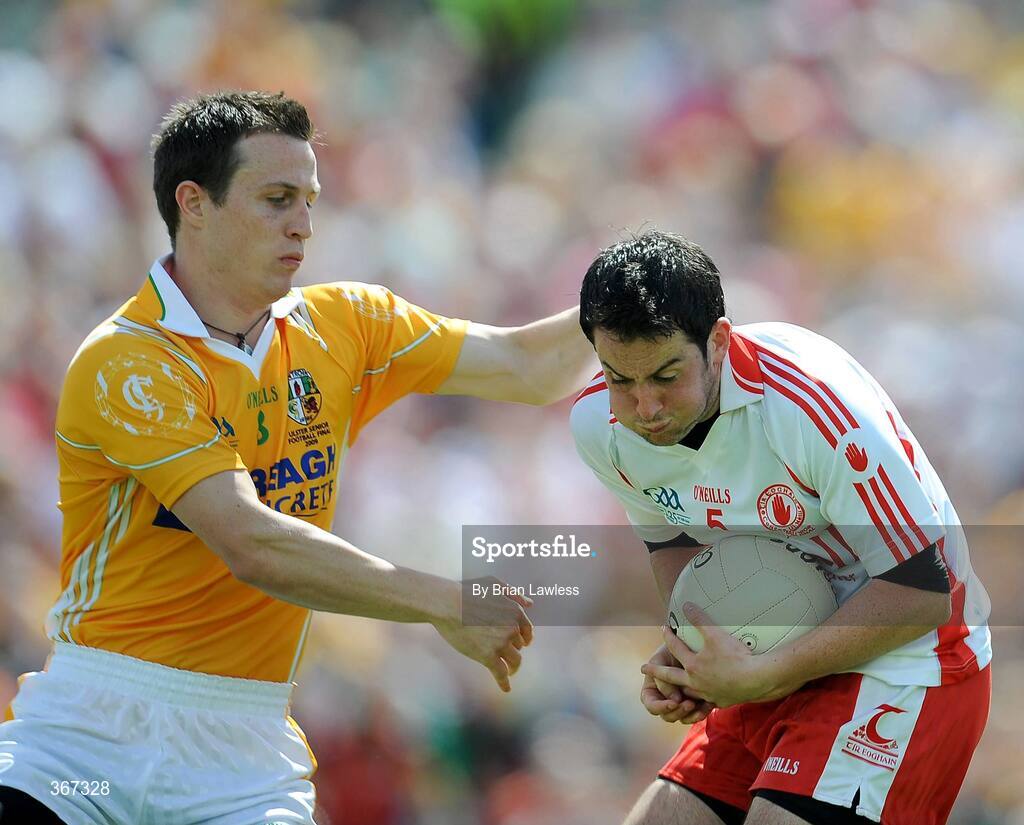 19 July 2009; Davy Harte, Tyrone, in action against Michael McCann, Antrim. GAA Football Ulster Senior Championship Final, Tyrone v Antrim, St Tighearnach's Park, Clones, Co. Monaghan. Picture credit: Brian Lawless / SPORTSFILE