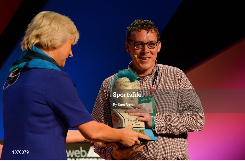 5 November 2015; Mary Collins, left, ESB, presents Gerard Forde, Bizimply, with the Spark of Genius Award on the Marketing Stage during Day 3 of the 2015 Web Summit in the RDS, Dublin, Ireland. Picture credit: Sam Barnes / SPORTSFILE / Web Summit