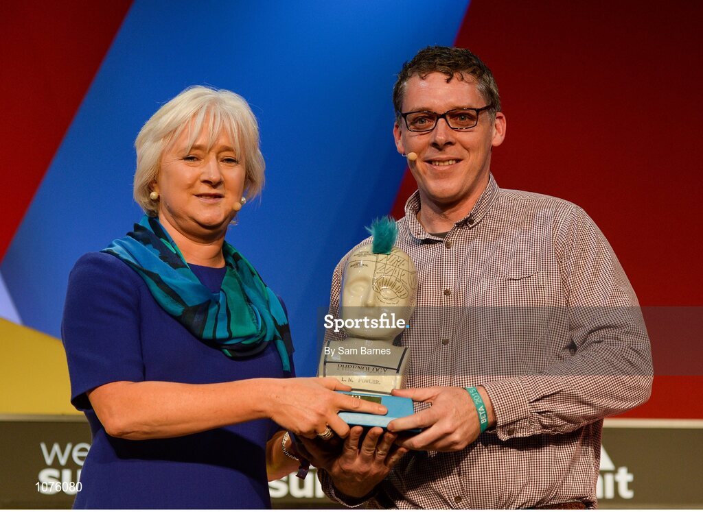 5 November 2015; Mary Collins, left, ESB, presents Gerard Forde, Bizimply, with the Spark of Genius Award on the Marketing Stage during Day 3 of the 2015 Web Summit in the RDS, Dublin, Ireland. Picture credit: Sam Barnes / SPORTSFILE / Web Summit