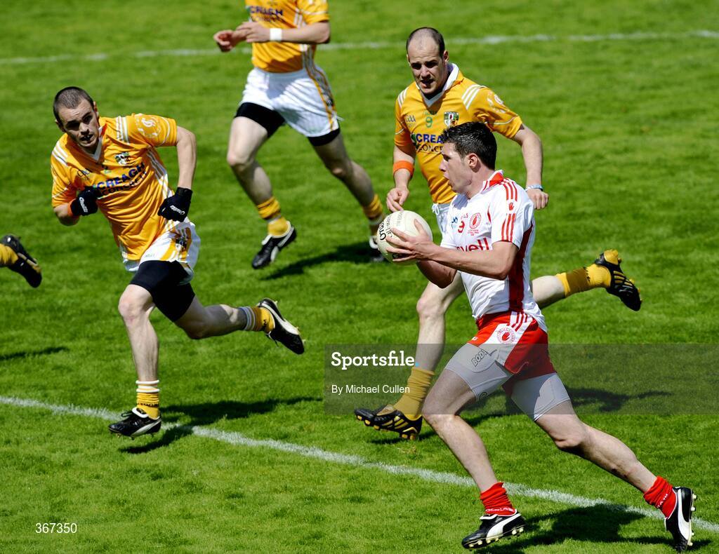 19 July 2009; Sean Cavanagh, Tyrone, in action against Andy McClean, left, and Michael McCann, Antrim. GAA Football Ulster Senior Championship Final, Tyrone v Antrim, St Tighearnach's Park, Clones, Co. Monaghan. Picture credit: Michael Cullen / SPORTSFILE