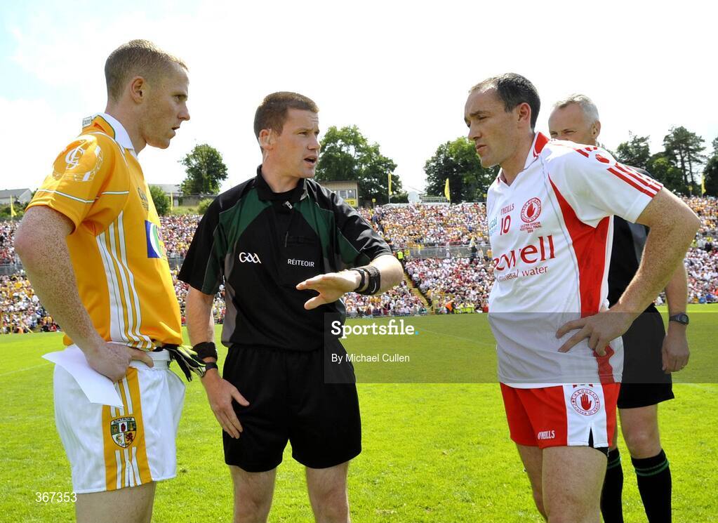 19 July 2009; Brian Dooher, Tyrone, and Paddy Cunningham, Antrim at the toss with referee Padraig Hughes, Armagh. GAA Football Ulster Senior Championship Final, Tyrone v Antrim, St Tighearnach's Park, Clones, Co. Monaghan. Picture credit: Michael Cullen / SPORTSFILE