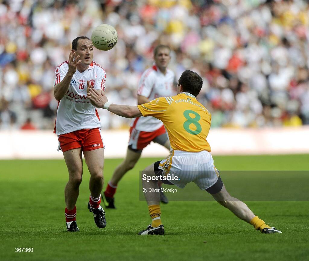 19 July 2009; Brian Dooher, Tyrone, in action against Michael McCann, Antrim. GAA Football Ulster Senior Championship Final, Tyrone v Antrim, St Tighearnach's Park, Clones, Co. Monaghan. Picture credit: Oliver McVeigh / SPORTSFILE