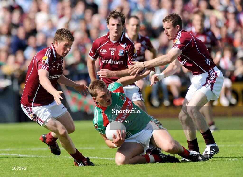 19 July 2009; Aidan O'Shea, Mayo, is surrounded by Galway players, from left, Gareth Bradshaw, Diarmuid Blake and Gary Sice. GAA Football Connacht Senior Championship Final, Galway v Mayo, Pearse Stadium, Salthill, Galway. Picture credit: Ray Ryan / SPORTSFILE