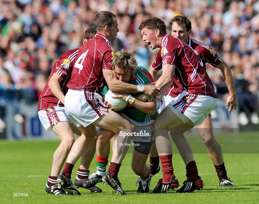 19 July 2009; Conor Mortimer, Mayo, in action against Damien Burke, no.4, Gareth Bradshaw, and Diarmuid Blake, Galway. GAA Football Connacht Senior Championship Final, Galway v Mayo, Pearse Stadium, Salthill, Galway. Picture credit: Ray Ryan / SPORTSFILE