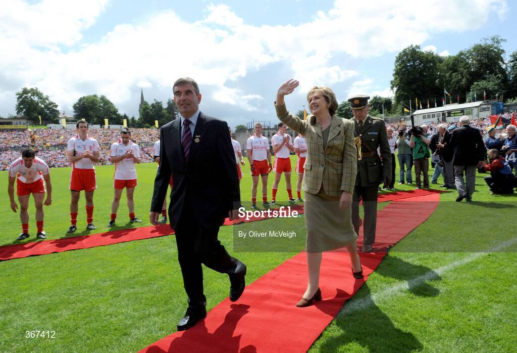 19 July 2009; President Mary McAleese waves to the crowd with Ulster GAA President Tom Daly before the game. GAA Football Ulster Senior Championship Final, Tyrone v Antrim, St Tighearnach's Park, Clones, Co. Monaghan. Picture credit: Oliver McVeigh / SPORTSFILE