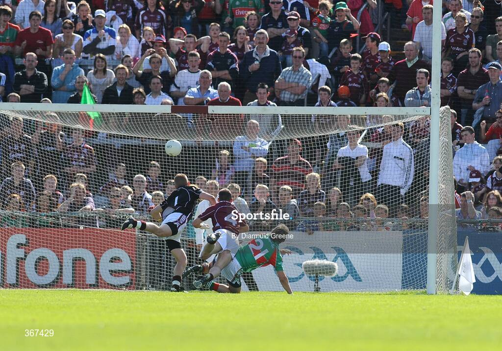 19 July 2009; Conor Mortimer, Mayo, scores his side's second goal past Galway goalkeeper Adrian Faherty and Damien Burke, 4. GAA Football Connacht Senior Championship Final, Galway v Mayo, Pearse Stadium, Salthill, Galway. Picture credit: Diarmuid Greene / SPORTSFILE