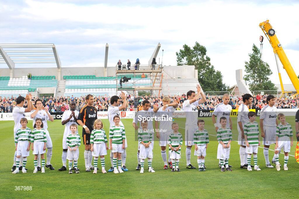 20 July 2009; Real Madrid players, from left, Cristiano Ronaldo, Fernando Gago, Lassana Diarra, Jerzy Dudek, Gonzalo Higuain, and Marcelo Vieira, Guti, Christoph Metzelder, Pepe, Miguel Torres and Raul with matchday mascots before the start of the game. Soccer Friendly, Shamrock Rovers v Real Madrid, Tallaght Stadium, Dublin. Picture credit: David Maher / SPORTSFILE