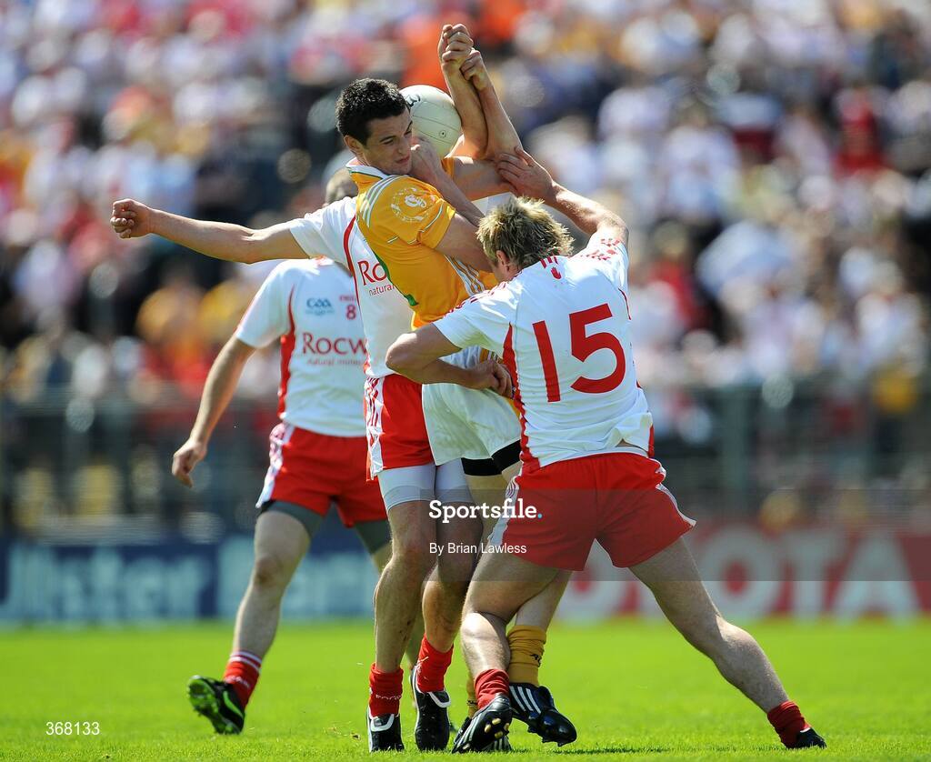19 July 2009; Niall McKeever, Antrim, in action against Sean Cavanagh and Owen Mulligan, right, Tyrone. GAA Football Ulster Senior Championship Final, Tyrone v Antrim, St Tighearnach's Park, Clones, Co. Monaghan. Picture credit: Brian Lawless / SPORTSFILE