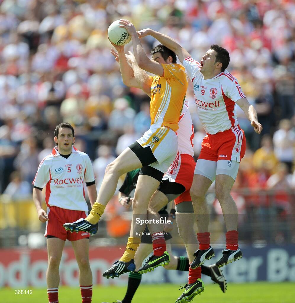 19 July 2009; Niall McKeever, Antrim, in action against Kevin Hughes and Sean Cavanagh, right, Tyrone. GAA Football Ulster Senior Championship Final, Tyrone v Antrim, St Tighearnach's Park, Clones, Co. Monaghan. Picture credit: Brian Lawless / SPORTSFILE