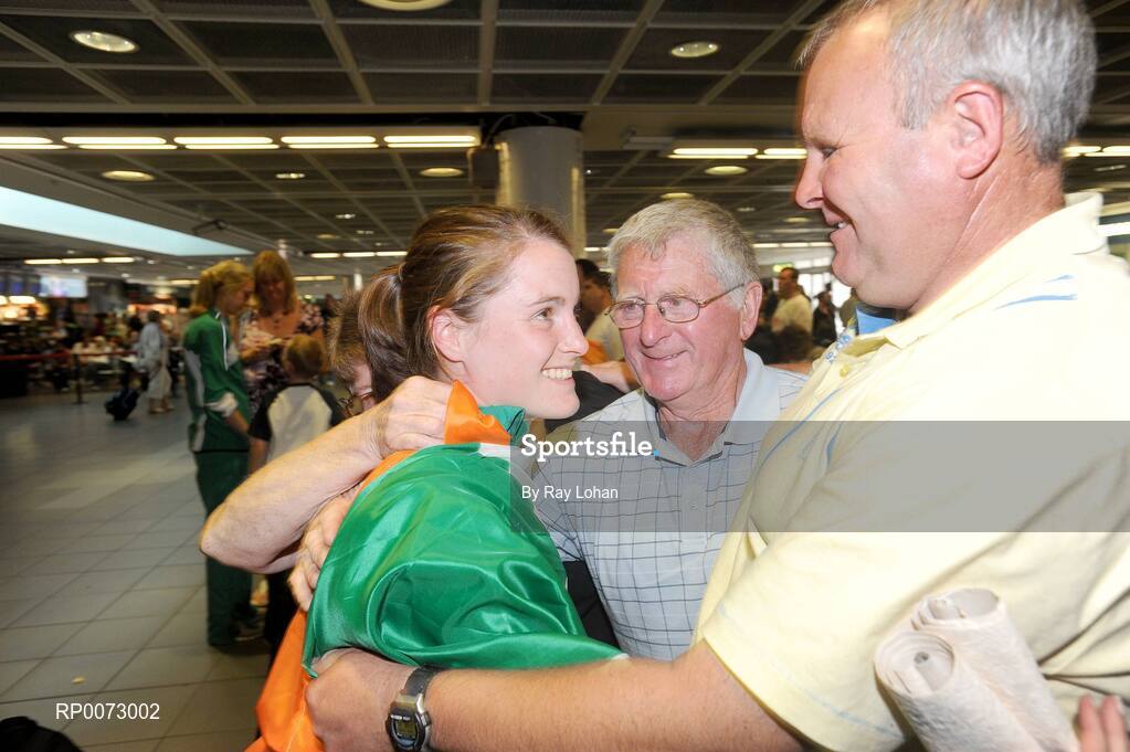 25 July 2009; Gold Medal winning European Youth Olympic athlete Ciara Mageean, left, with her grandfather Paddy Mason and her father Chris Mageean after her arrival at Dublin Airport, Dublin. Picture credit: Ray Lohan / SPORTSFILE