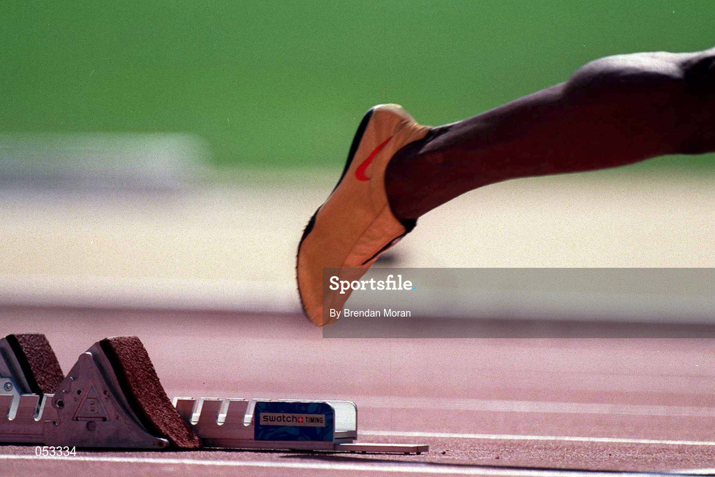 22 September 2000; A general view of golden track spikes worn by Michael Johnson of USA as he leaves the starting blocks in the men's 400m at Stadium Australia in Sydney Olympic Park, Homebush Bay, Sydney, Australia.  Photo by Brendan Moran/Sportsfile