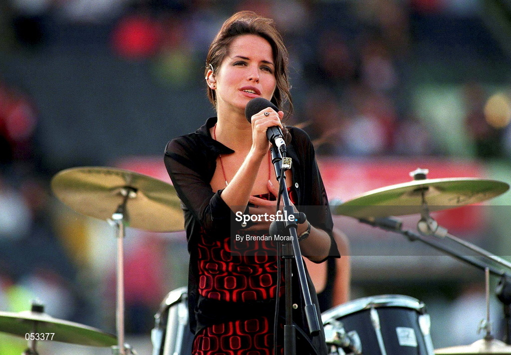 27 July 1997; Singer Andrea Corr, of the band The Corrs, sings before the American Bowl between Chicago Bears and Pittsburgh Steelers at Croke Park in Dublin. Photo by Brendan Moran/Sportsfile